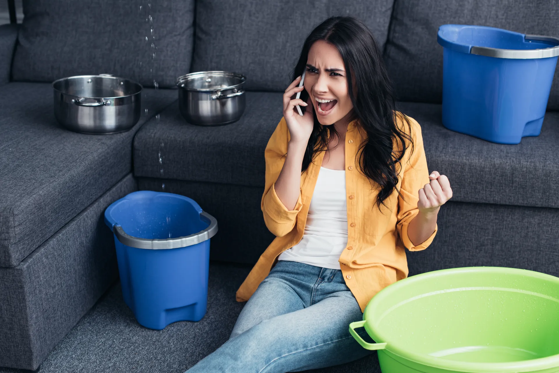 Frustrated homeowner dealing with a plumbing emergency